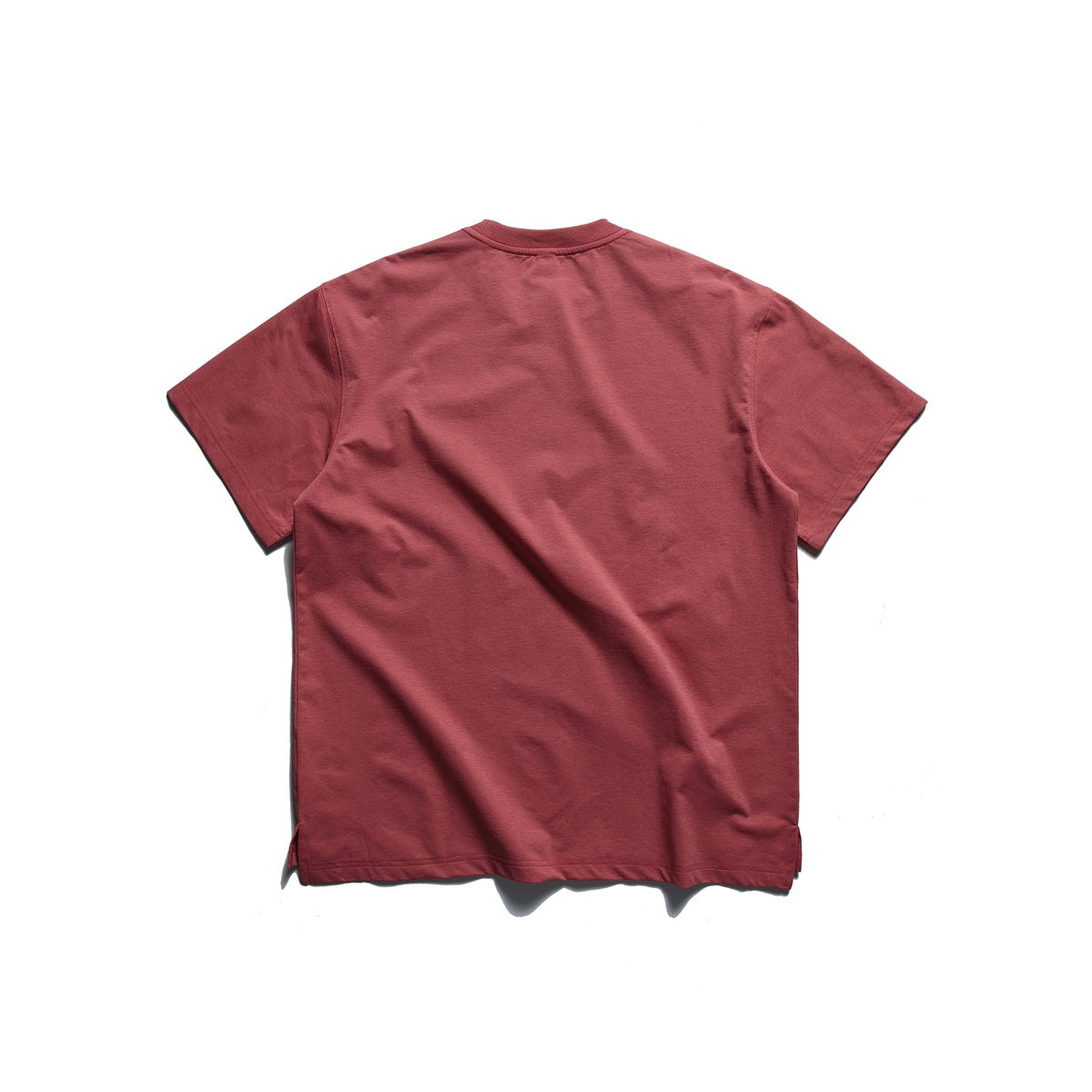 Back view of a plain muted red short-sleeve crew-neck T-shirt on a white background.
