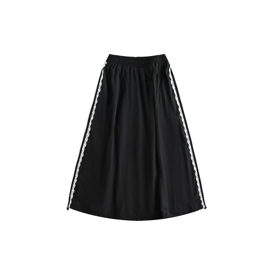 Back view of black A-line midi skirt with elastic waist and white scalloped lace trim along both side seams