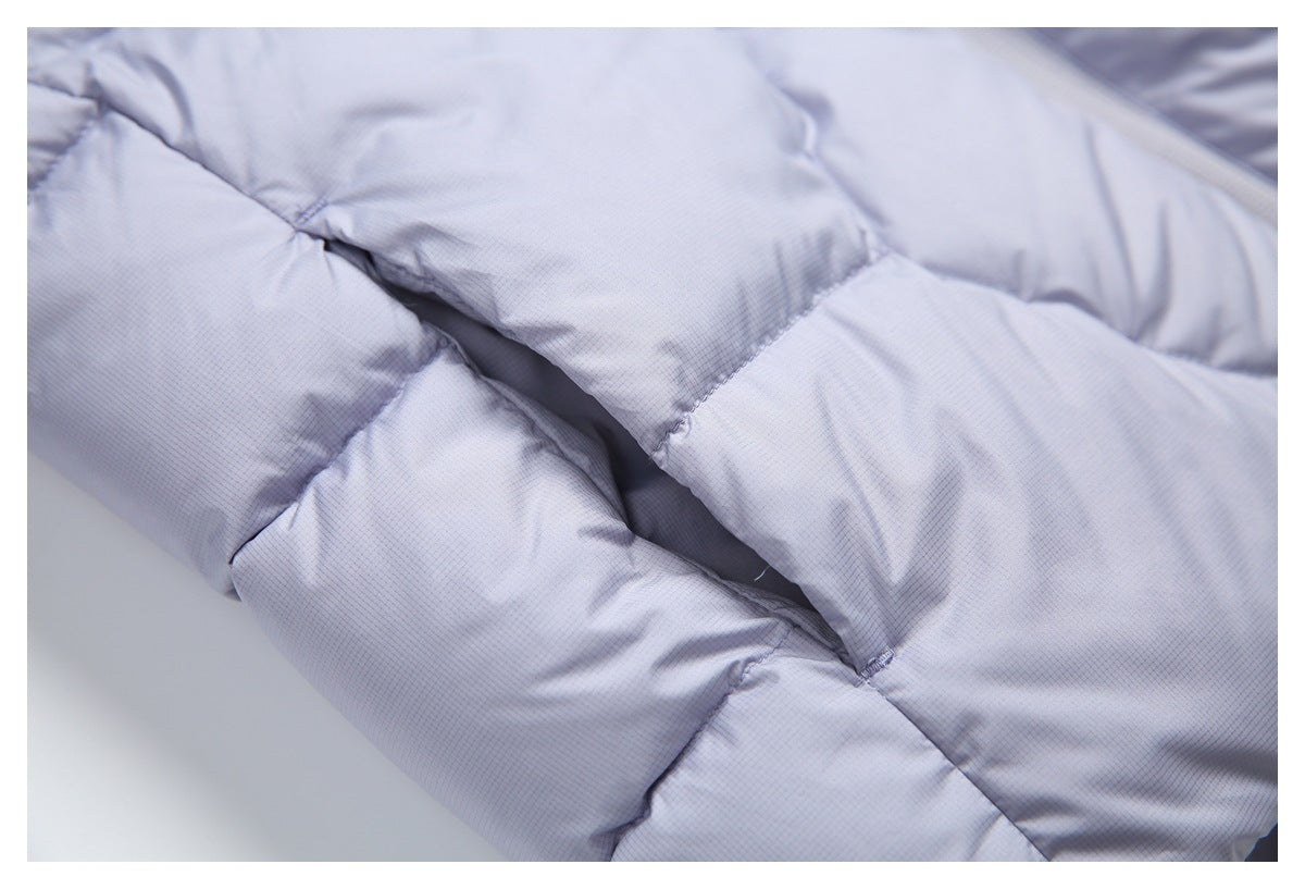 Close-up showing the pale lavender jacket's padded quilting and stitched seams.