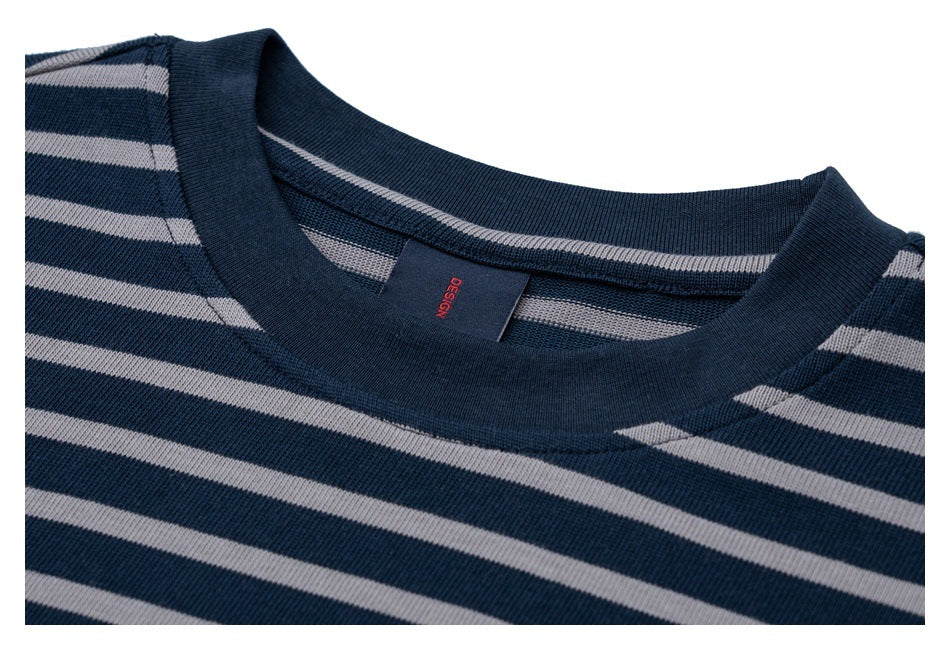 Close-up of the striped T-shirt's navy crew neck and inner label.
