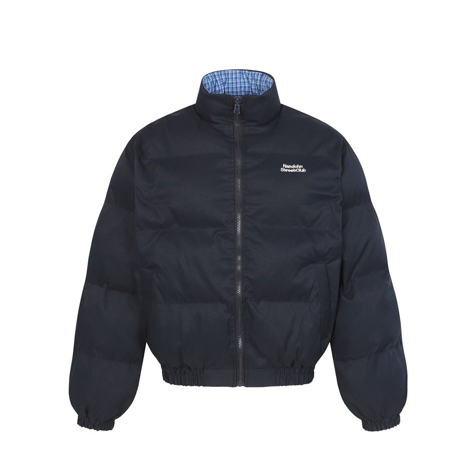 Dark navy quilted puffer bomber jacket with stand collar, front zipper and small white embroidered chest logo