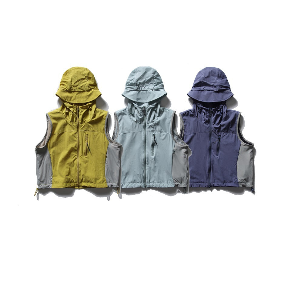 Three sleeveless hooded vests shown from the front in mustard, pale blue, and navy, each with gray side panels.
