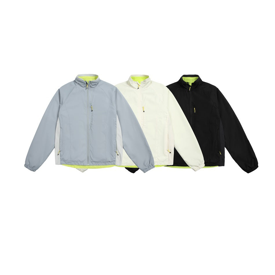 Three zip-front jackets shown together in pale blue, cream and black, each with bright lime interior accents.