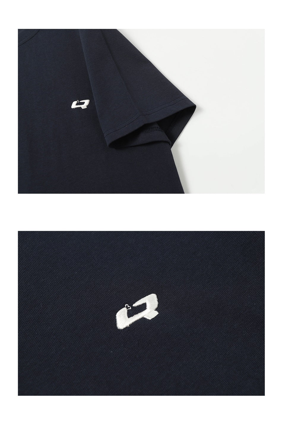 Close-up of a dark navy shirt sleeve and a small white embroidered chest emblem.