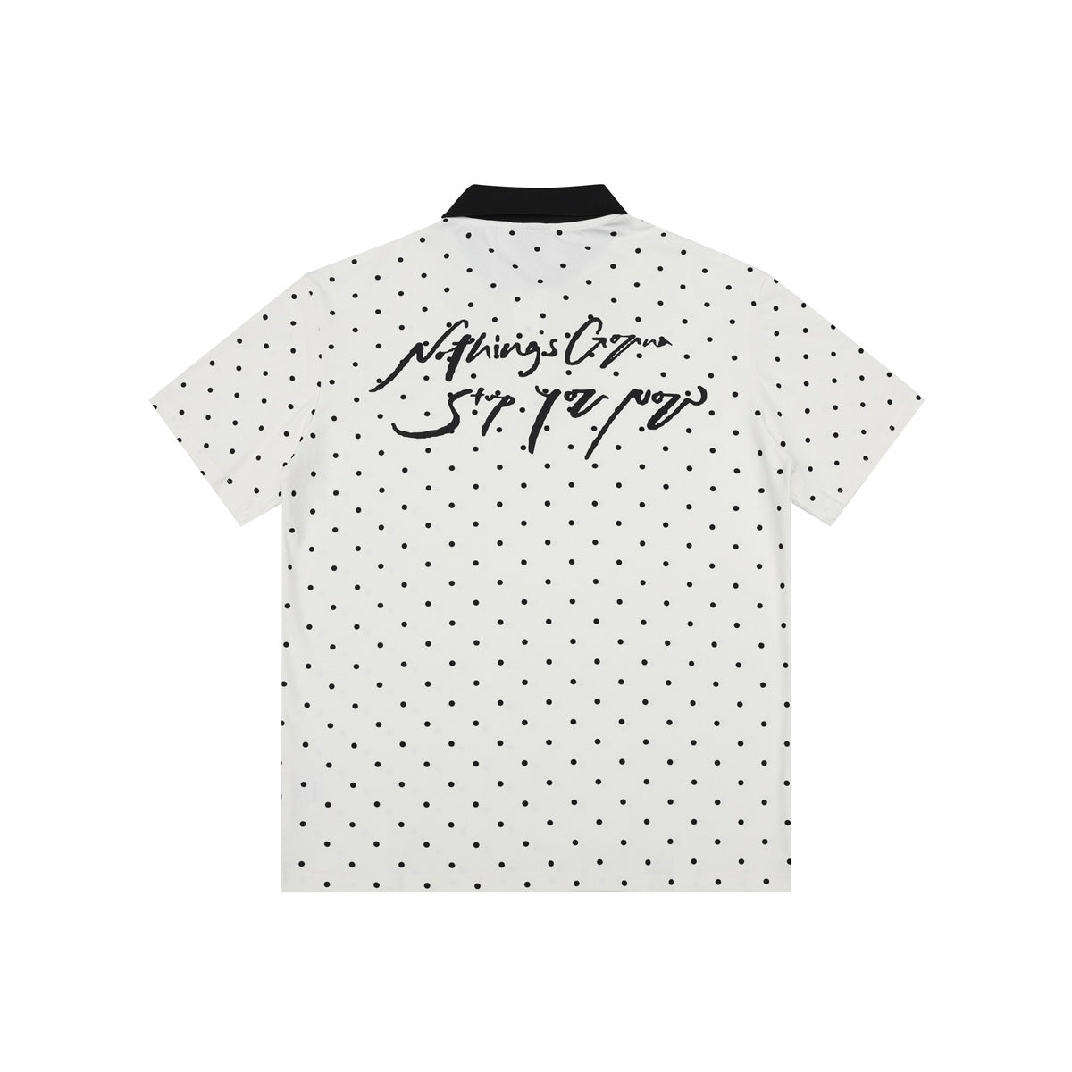 Back of white polo shirt with black polka dots, black collar and black handwritten script graphic on the upper back