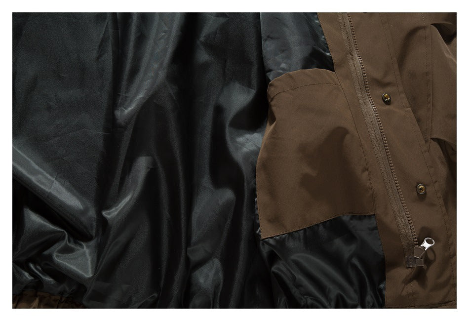 Close-up of the brown jacket's interior pocket, dark lining, zipper, and snap fasteners.