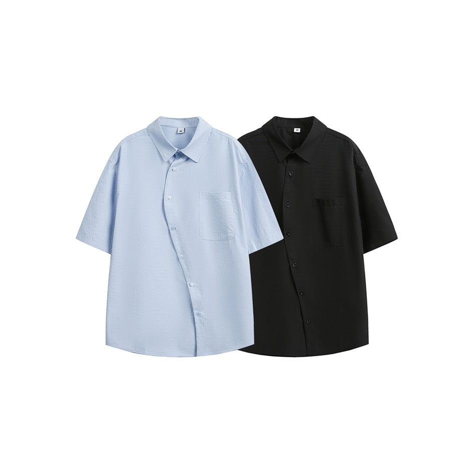 Light blue and black short-sleeve button-up shirts, each with a collar and single chest pocket.