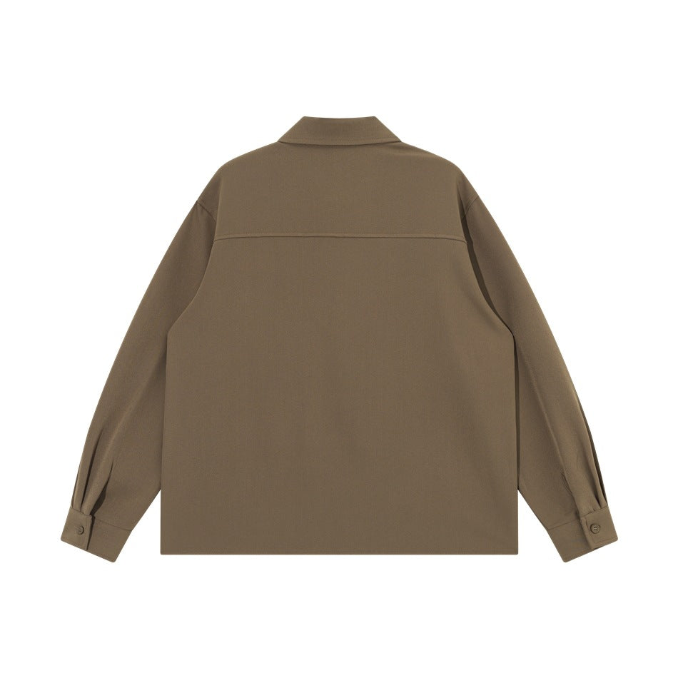 Back view of a brown long-sleeved button-up shirt with a horizontal yoke seam and buttoned cuffs.