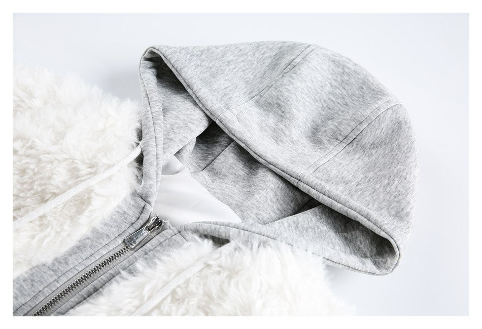Close-up of the jacket's light gray hood, drawstring, zipper and white fluffy panels.