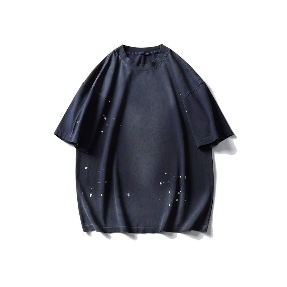 Navy washed short-sleeve crew-neck T-shirt with white paint splatter, flat front view