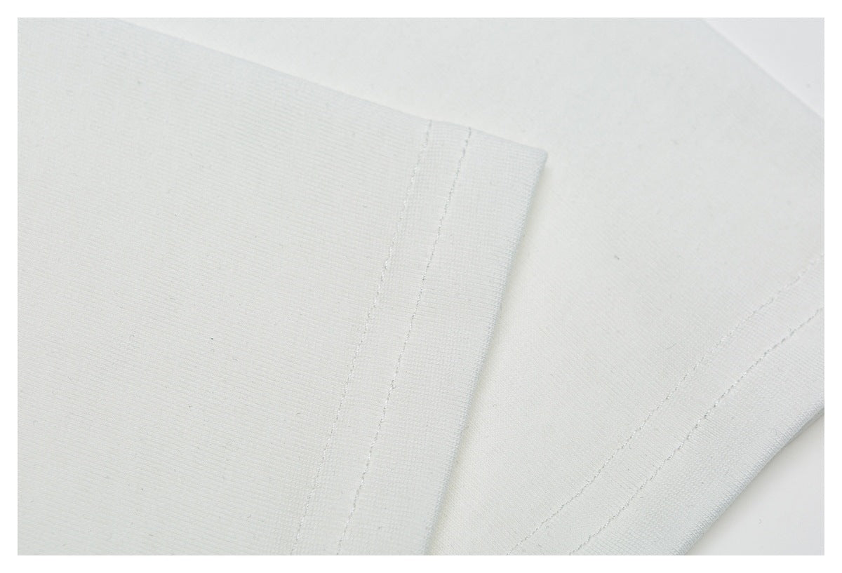Close-up of a white garment sleeve edge with double-row stitching.