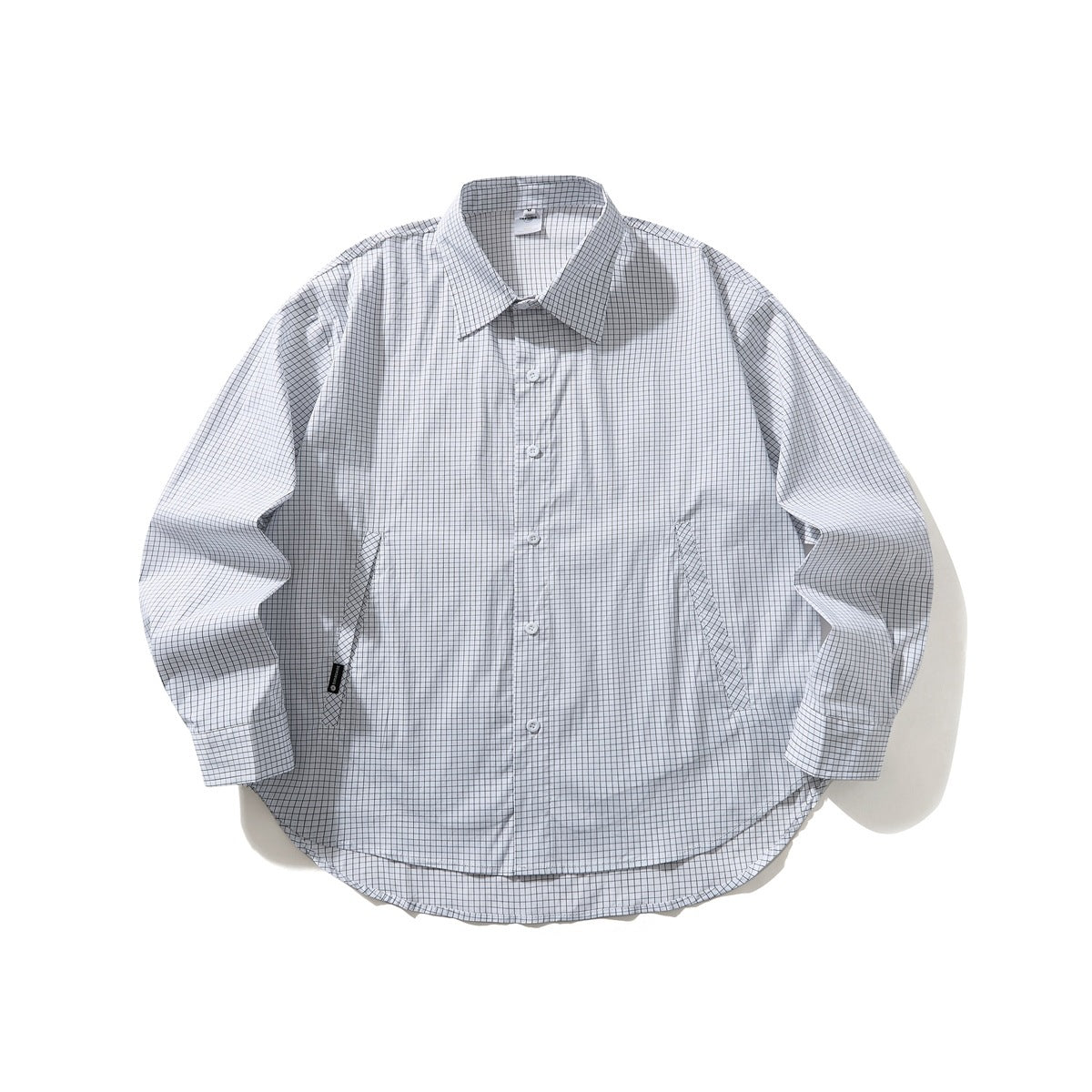 White long-sleeve button-up shirt with a fine dark grid check, pointed collar and curved hem, laid flat