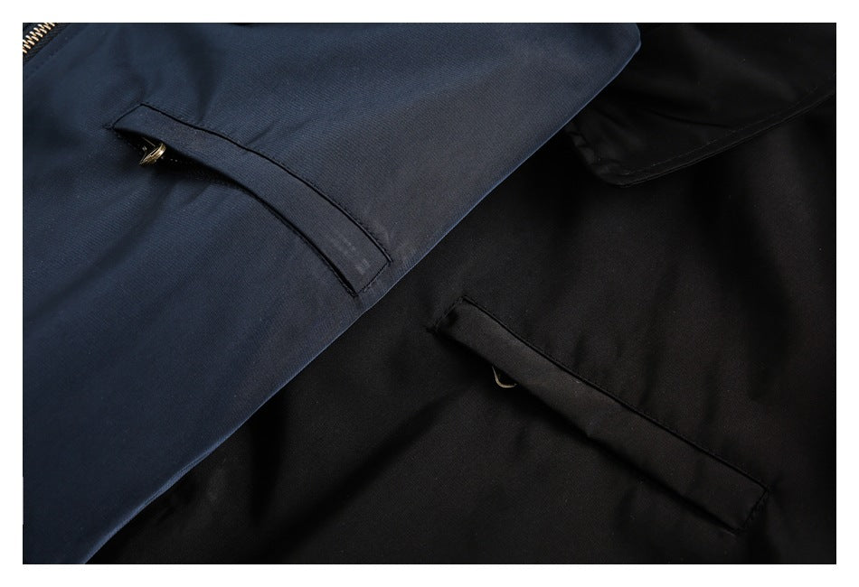 Close-up of slanted welt pockets on navy and black jackets, with small metal hardware visible.