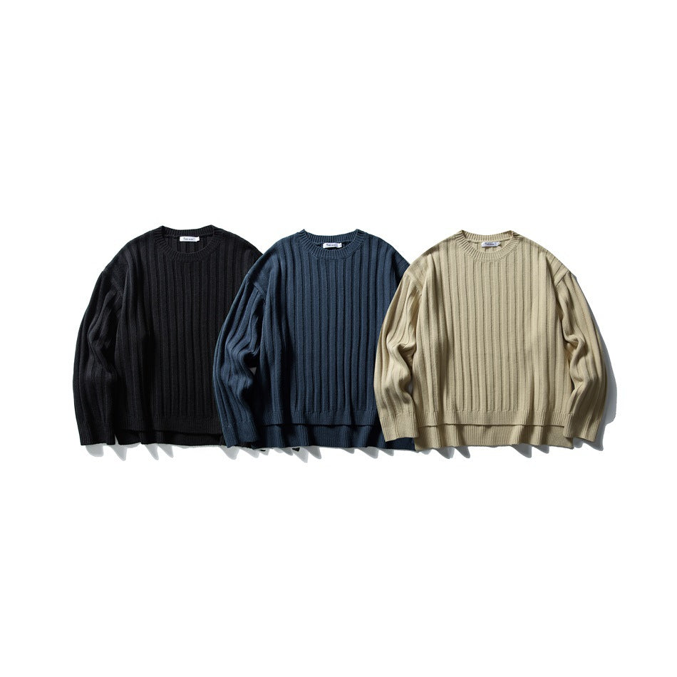 Three ribbed crewneck sweaters shown together in black, navy, and beige.