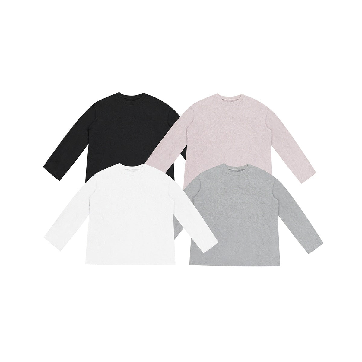 Four long-sleeve crew-neck tops in black, light pink, white and gray laid flat and overlapping