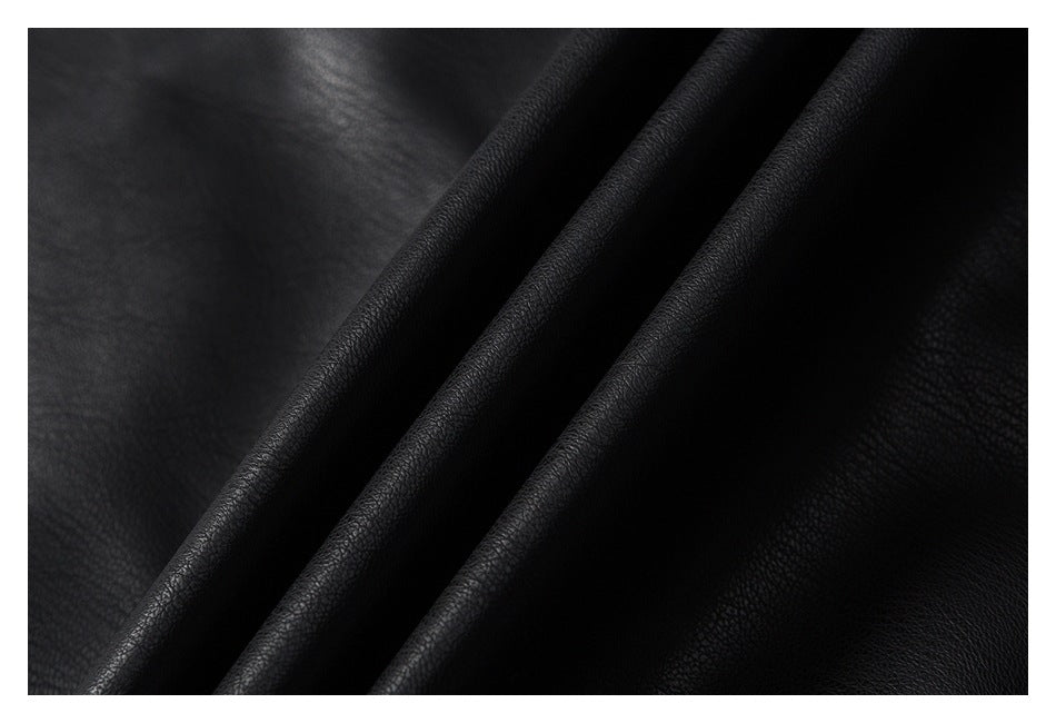 Close-up showing the pebbled texture and folds of black jacket material.