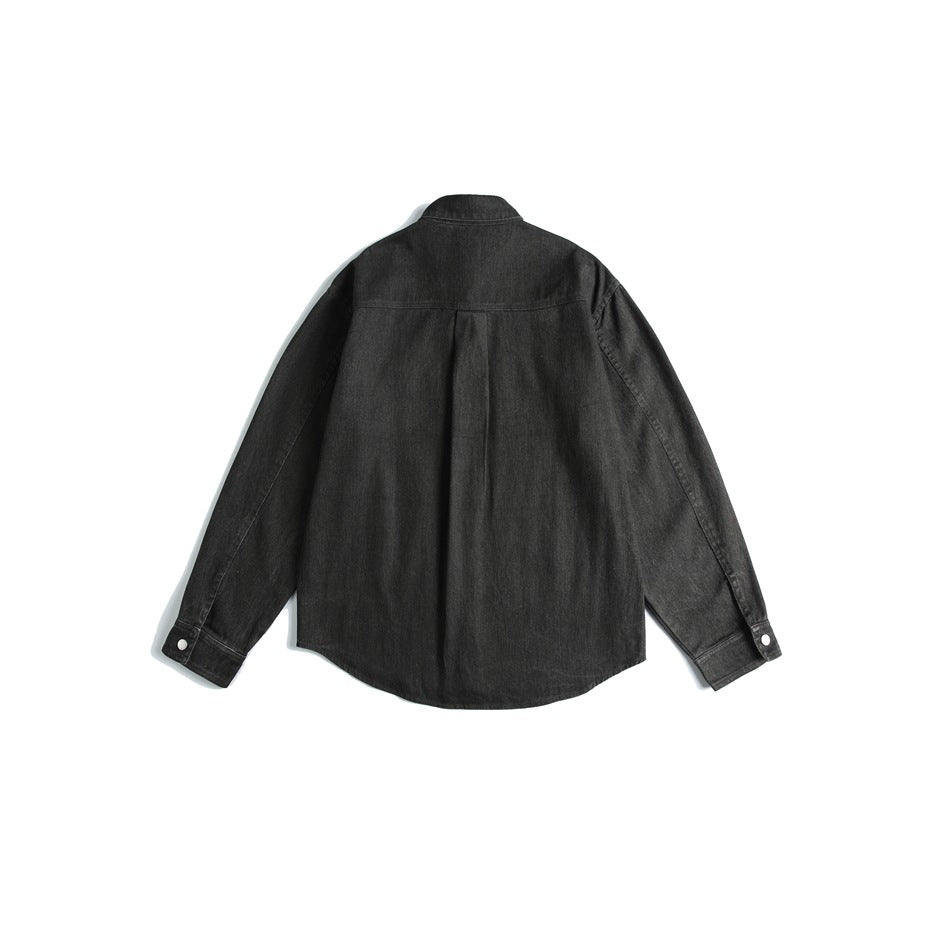 Back view of a dark charcoal long-sleeved overshirt with a center pleat and snap cuffs.