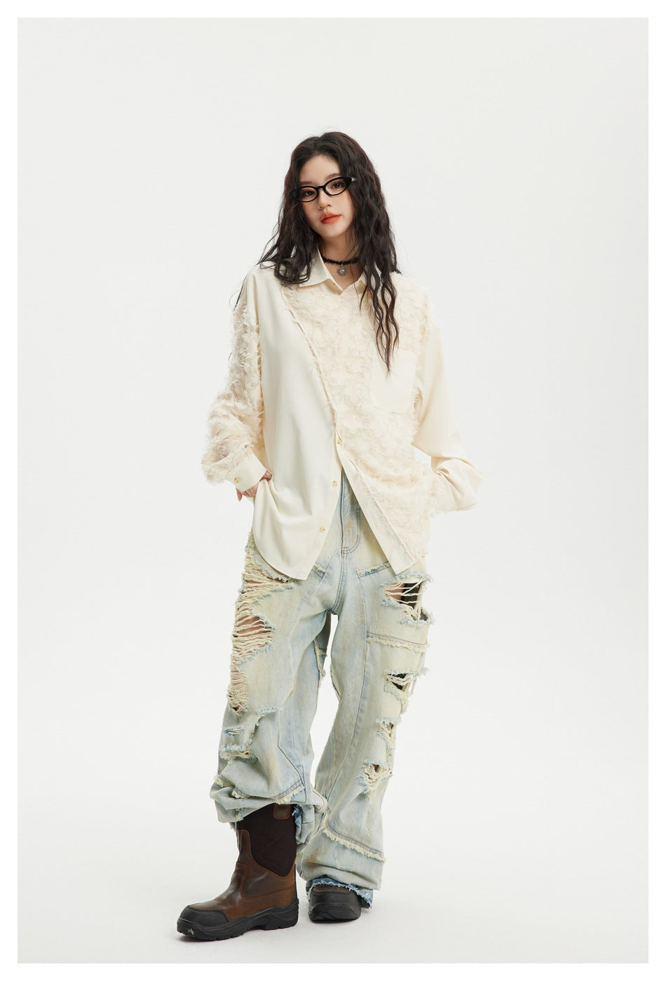 Model in an oversized ivory button-front shirt with shaggy textured panels and a chest pocket, styled with ripped jeans.