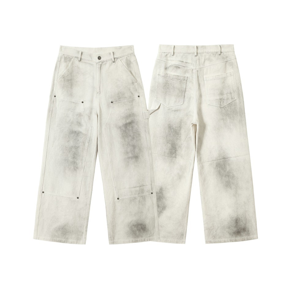 Off-white wide-leg pants shown from front and back, with gray mottling, utility panels, and two rear pockets.