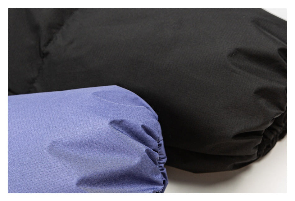 Close-up of gathered black and periwinkle garment cuffs shown together.