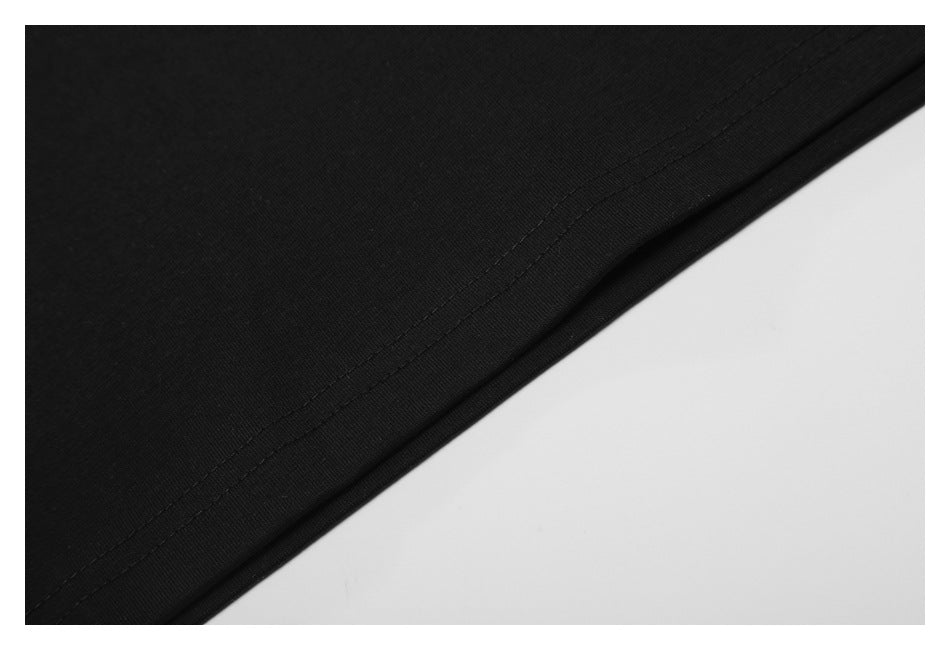 Close-up of black fabric with a diagonal double-stitched edge.