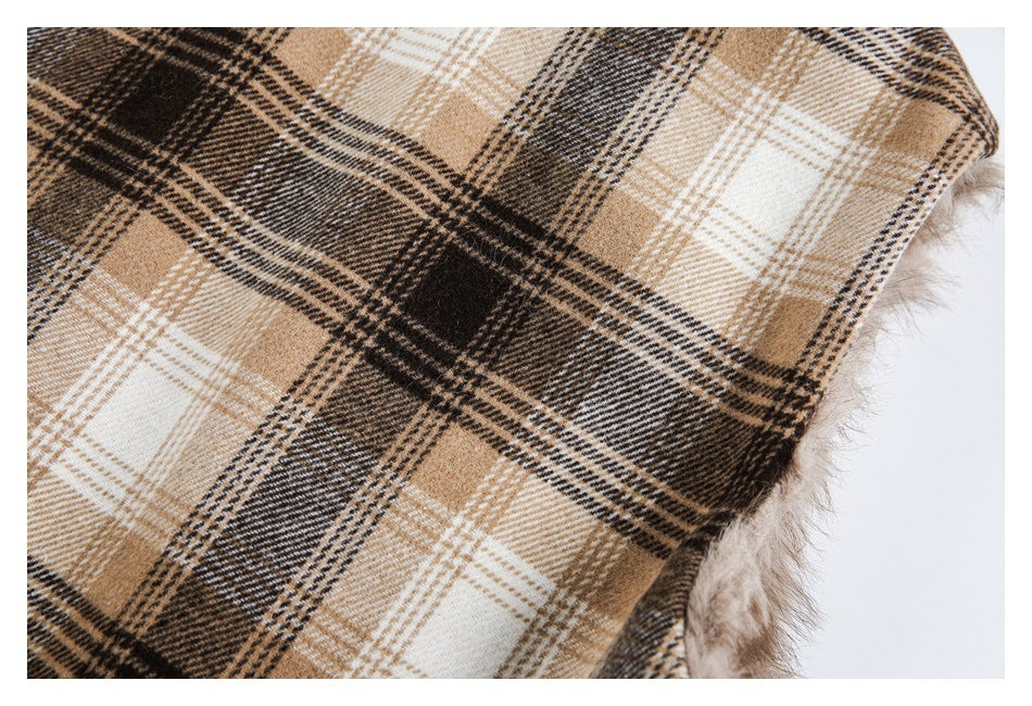Close-up of brown, tan, cream, and black plaid fabric with a fuzzy edge.