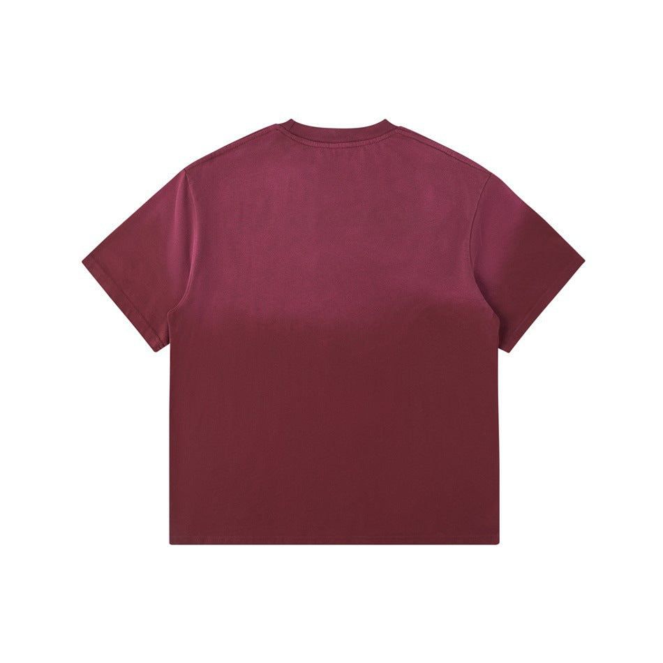 Back view of a burgundy red washed gradient crew-neck T-shirt, plain with no print, flat lay