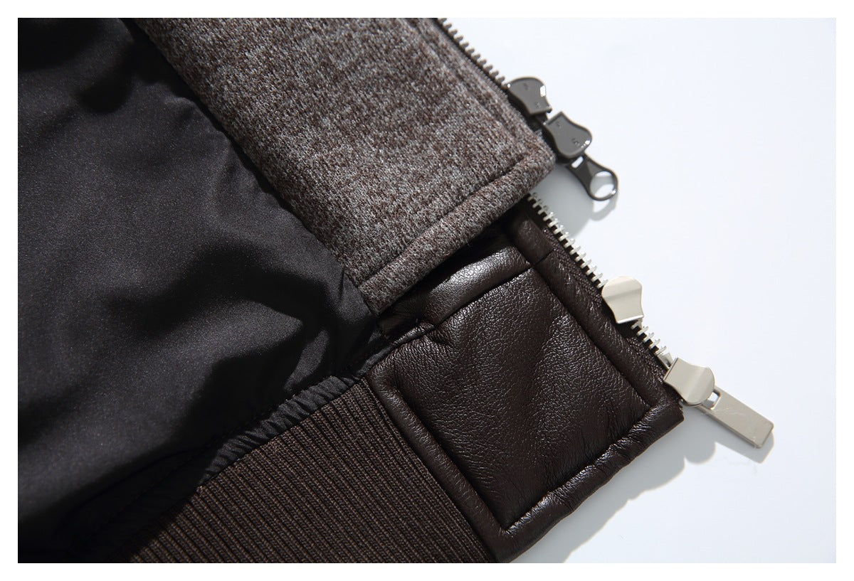 Close-up of a dark brown jacket hem with rib-knit trim, quilted panel and metal zipper hardware.