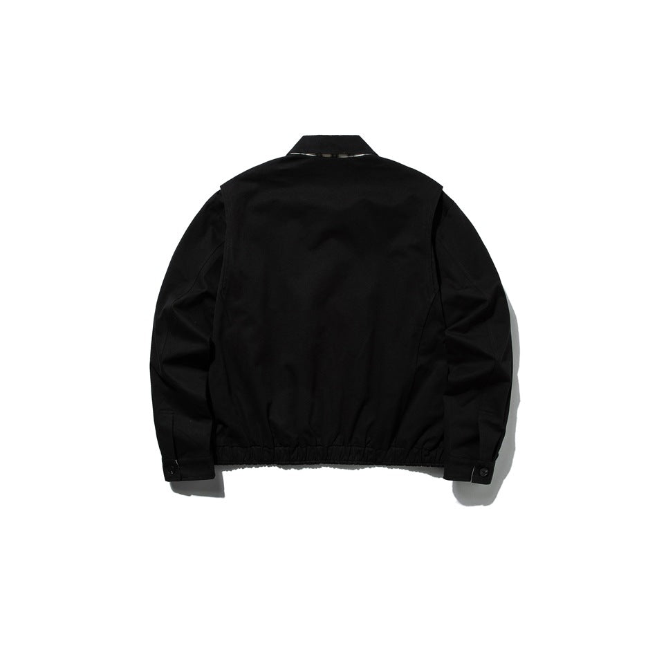 Black cropped jacket, flat lay back view, with elastic gathered hem, buttoned cuffs and back yoke seam