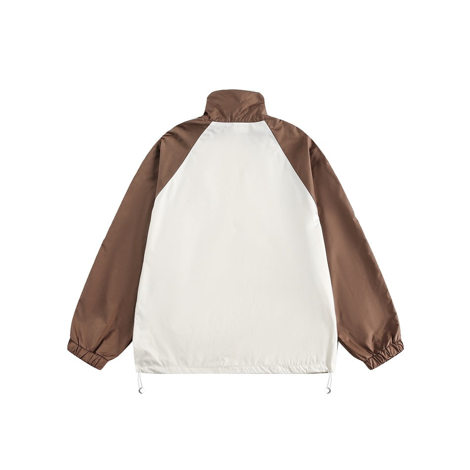 Back view of a cream-and-brown color-block jacket with a raised collar, elastic cuffs, and adjustable hem cords.