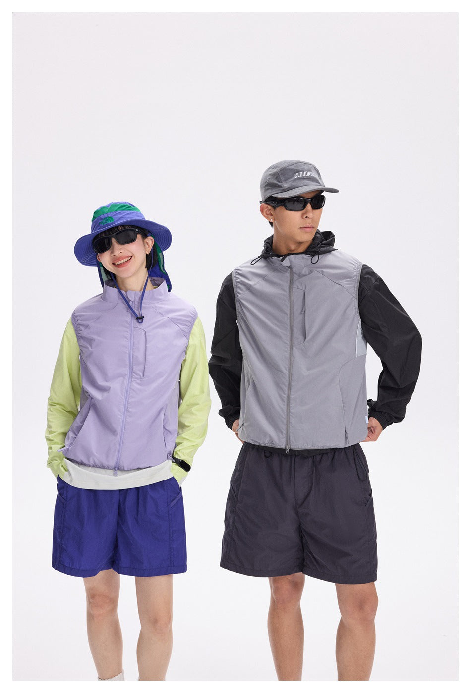 Two models wear lightweight zip vests: lavender with lime sleeves and blue shorts, and gray with black sleeves and dark