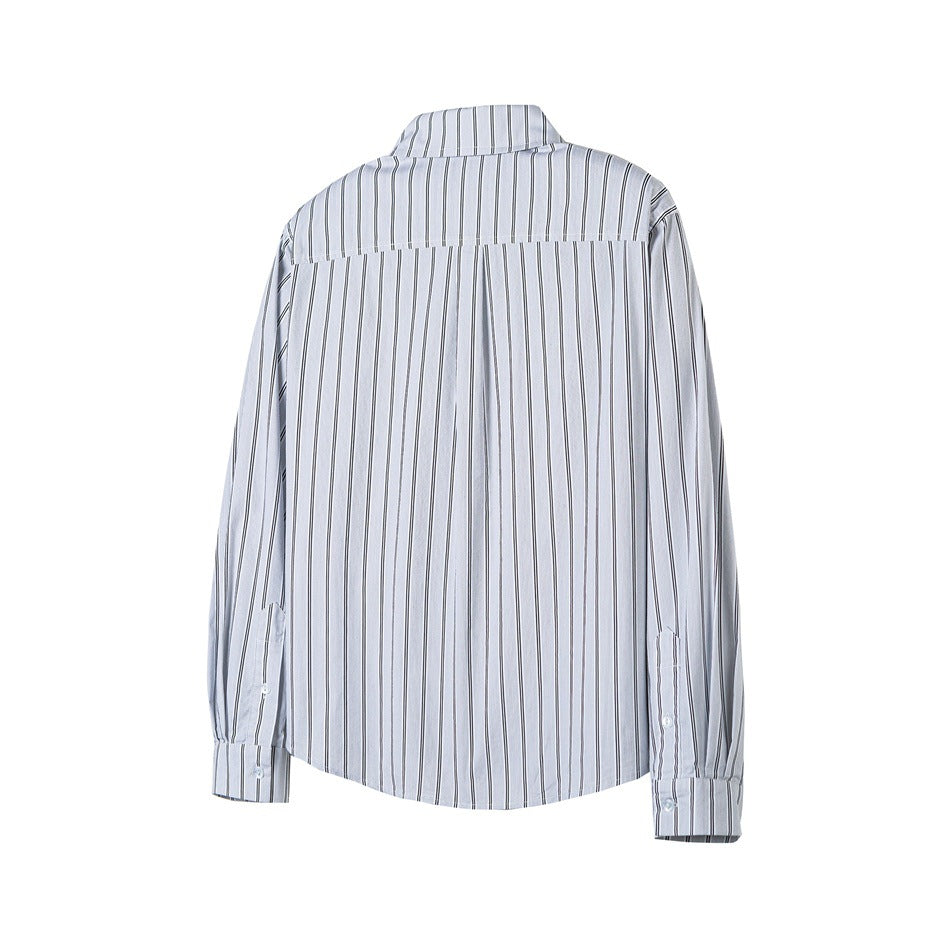 Back view of striped long-sleeve shirt showing yoke seam, center pleat and buttoned cuffs