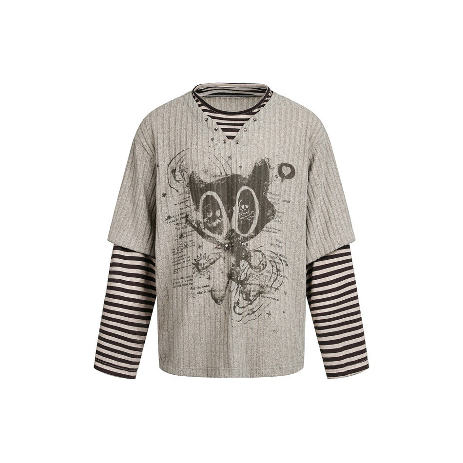 Coffee-brown ribbed faux two-piece top with cat graphic, V-neck studs and brown-beige striped sleeves, flat front view
