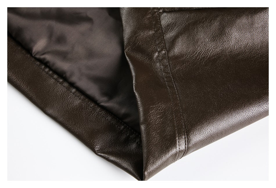 Close-up showing the dark brown jacket's edge, seam, and dark inner lining.