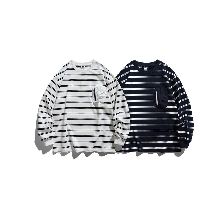 Two long-sleeve striped shirts shown from the front: ivory with navy stripes and navy with ivory stripes, each with a chest