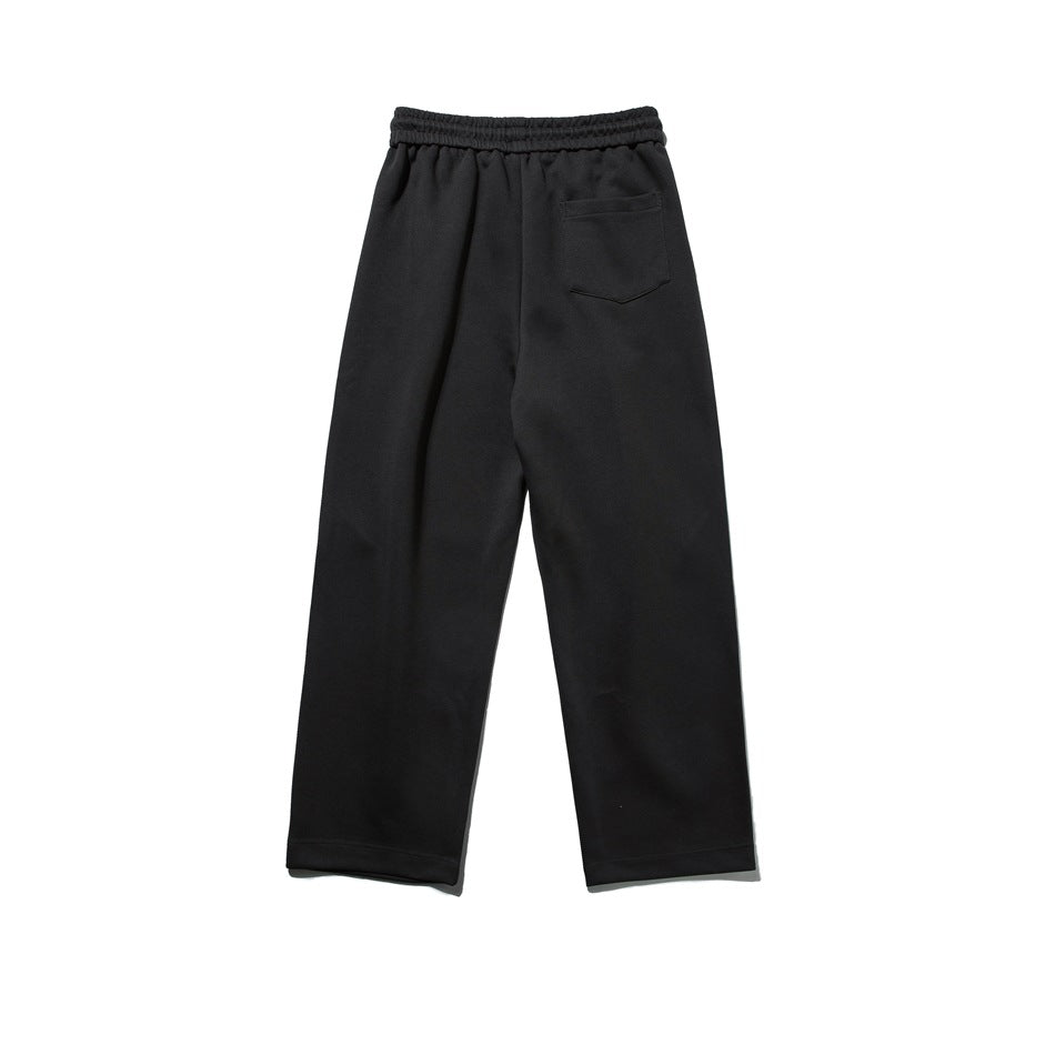 Back view of black relaxed pants with an elastic waistband and a single back pocket.