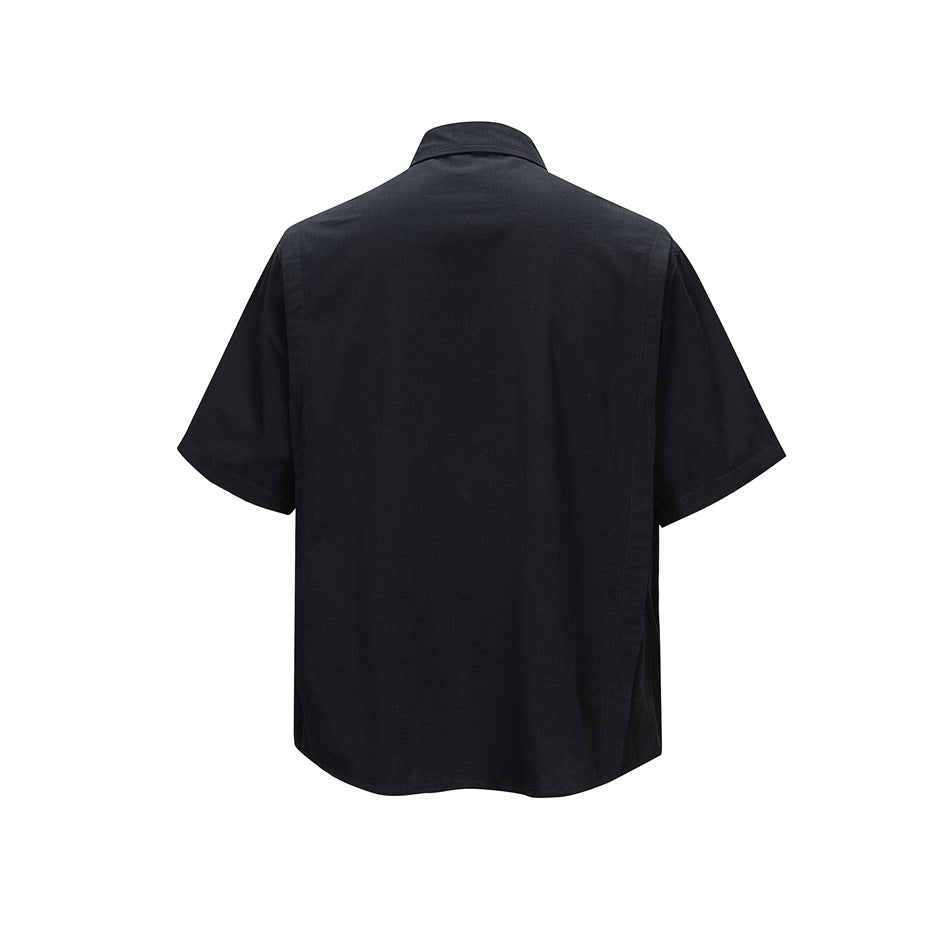 Back view of a black short-sleeve collared shirt with a plain back and curved hem.