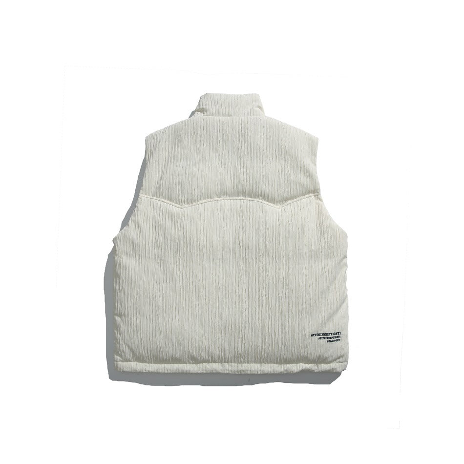 Back of an ivory sleeveless vest with a high collar, textured vertical crinkles, curved yoke seam, and small text near the
