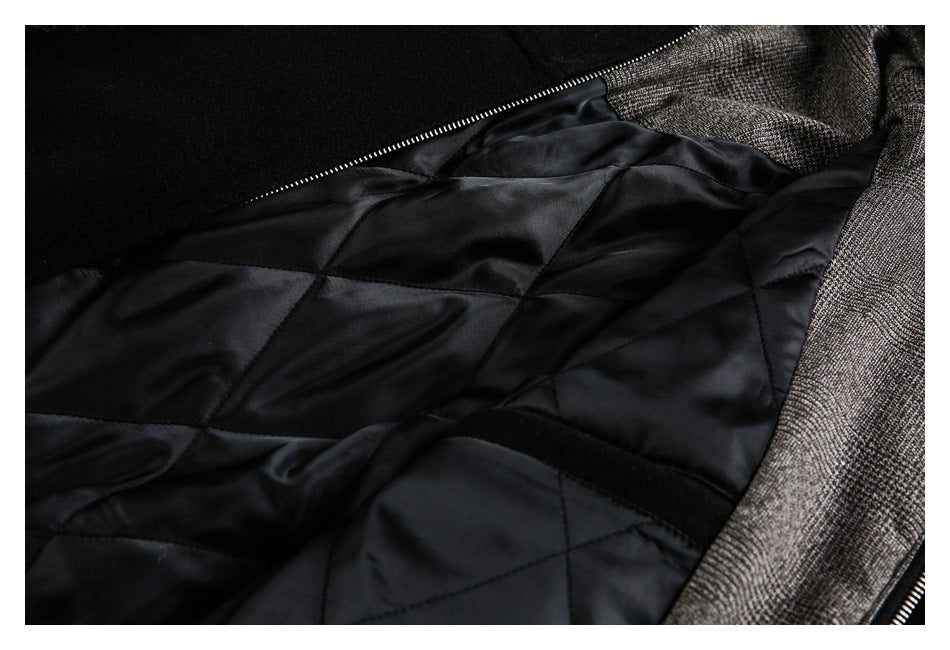 Open garment showing glossy black quilted lining, zipper, and gray patterned outer fabric.
