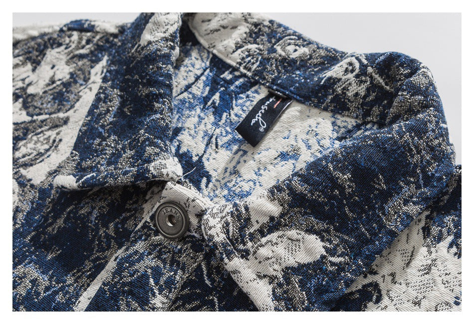 Close-up of the jacket's blue and cream woven floral pattern, collar, button, and inner neck label.