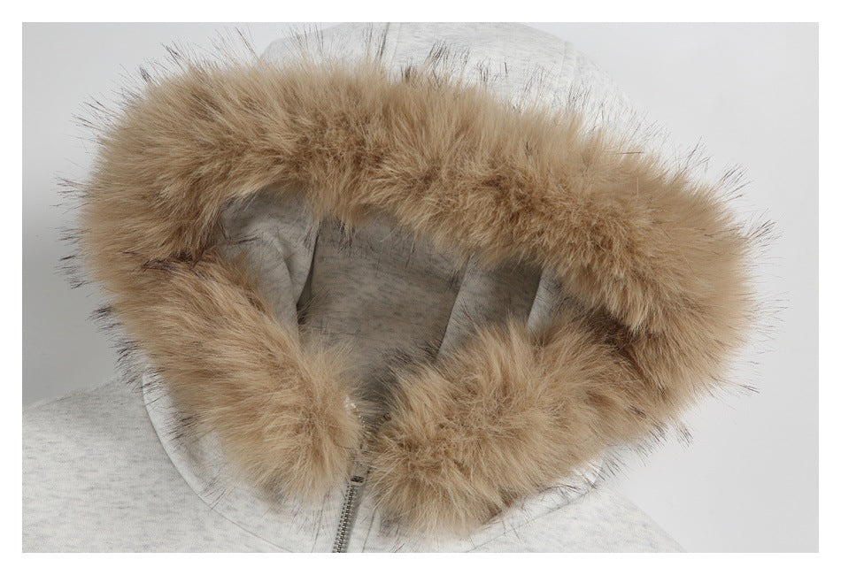 Close-up of the hoodie’s oversized tan fur-trimmed hood and gray lining.
