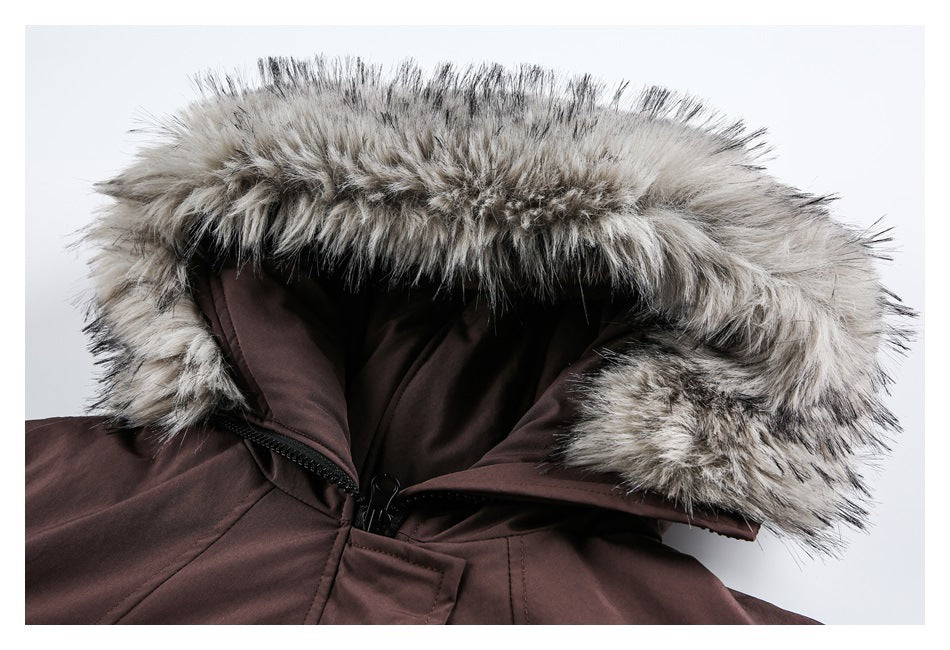 Close-up of the gray-and-cream fur-trimmed hood opened to show its dark brown lining and zipper.