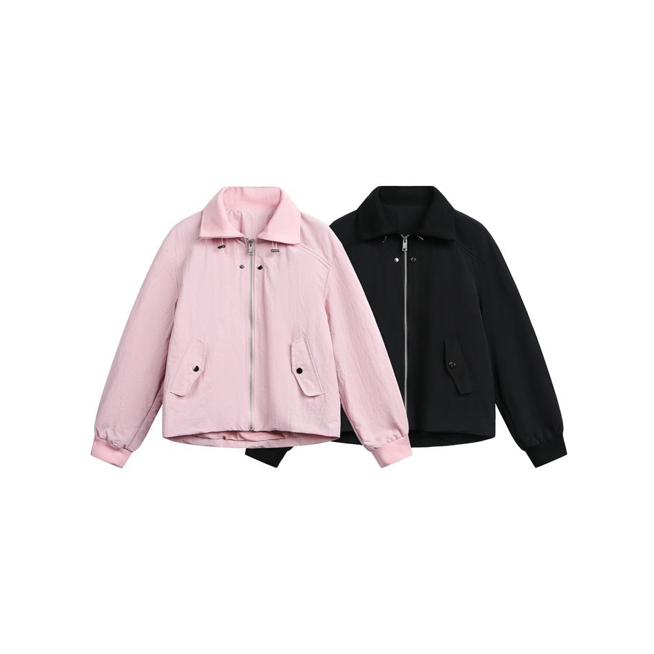 Two collared zip-front jackets displayed together, one light pink and one black, each with long sleeves and flap pockets.