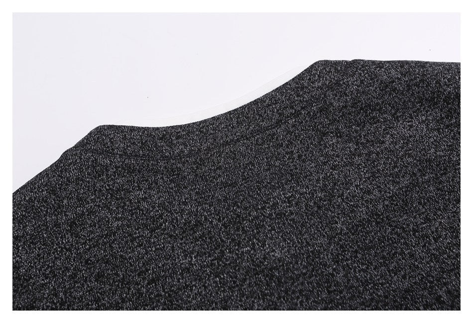 Close-up of the charcoal marled fabric across a curved garment panel.