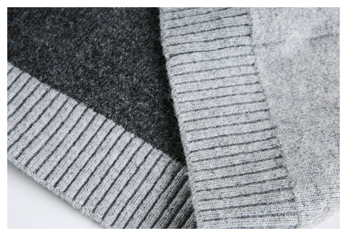Close-up showing a charcoal knit panel, light gray ribbed trim, and a light gray knit section.