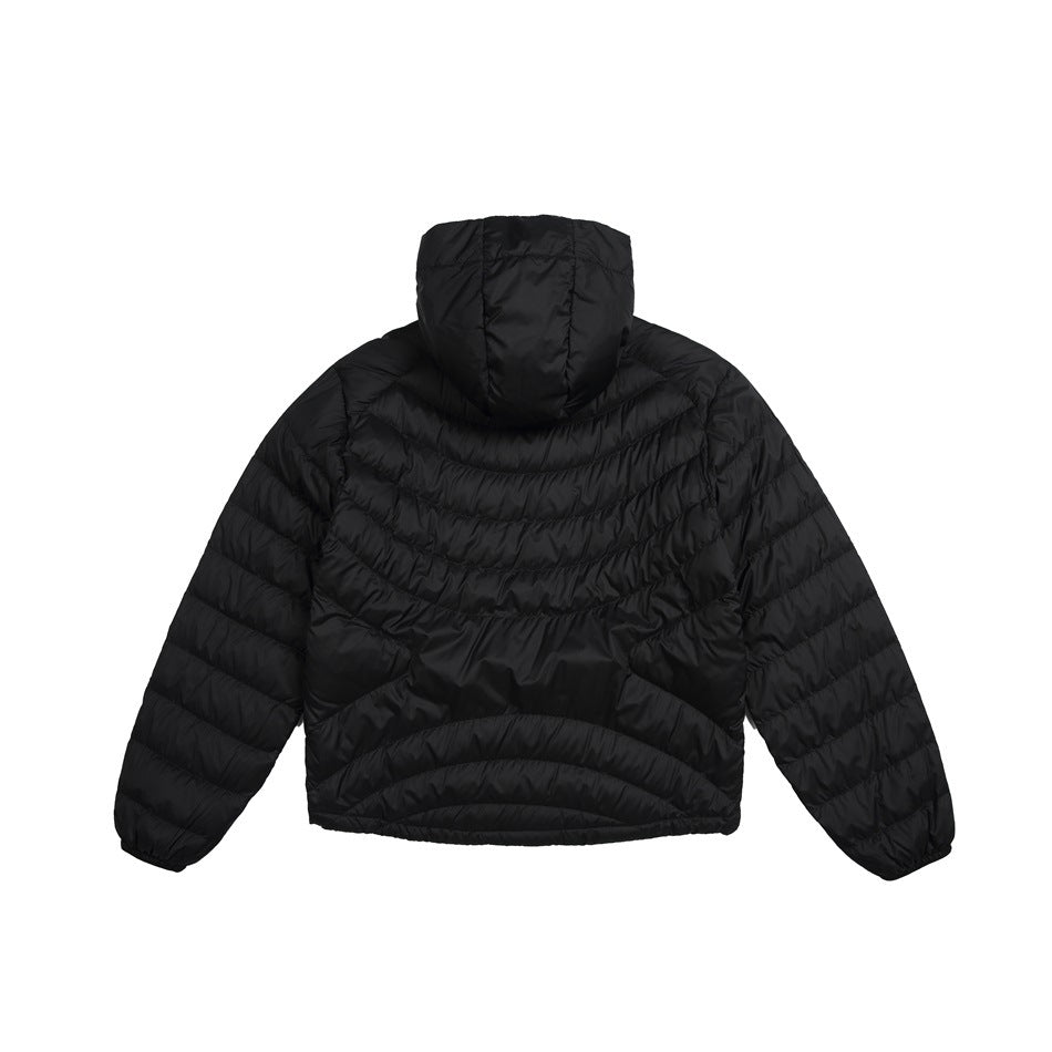 Back view of a black quilted hooded jacket with curved quilting and long sleeves.