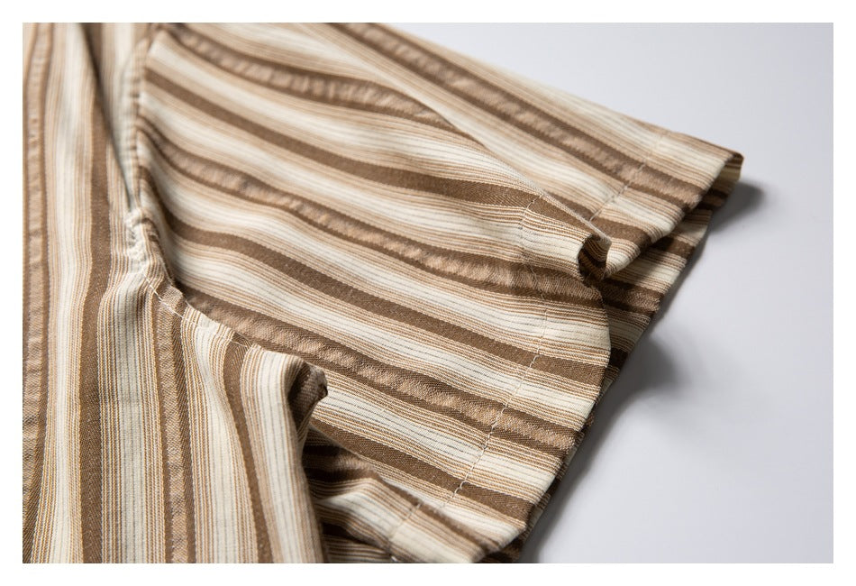 Close-up of the striped shirt’s short sleeve and stitched cuff.