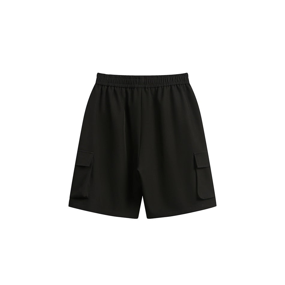 Black shorts shown from the front, with an elastic waistband and flap cargo pockets on both legs.