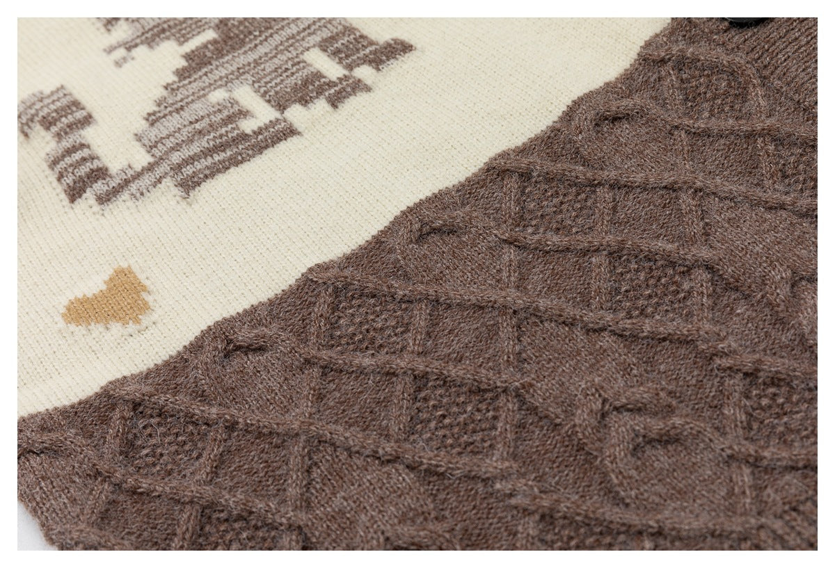 Close-up of the cardigan's brown textured knit and cable pattern beside part of an ivory graphic panel.