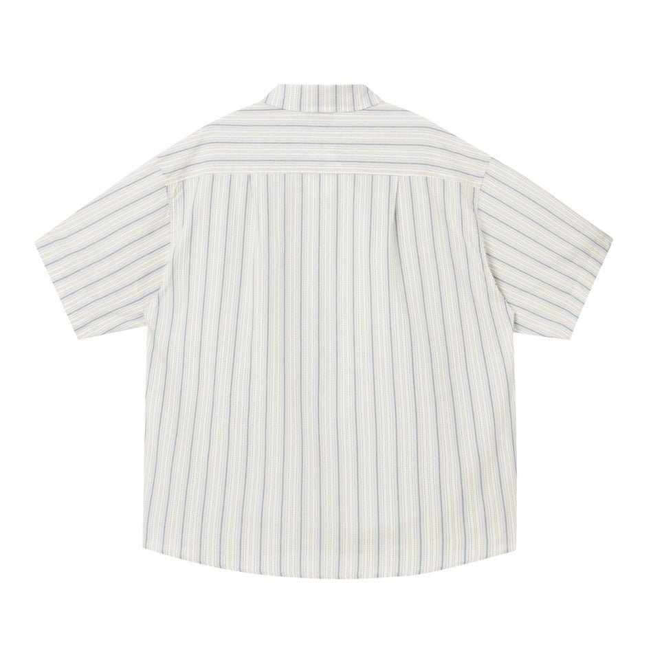 Back view of beige striped short-sleeve shirt with yoke seam and center pleat, flat lay